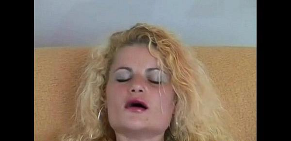  Trashy blonde slut in black stockings sodomizes pussy with fingers and dildo